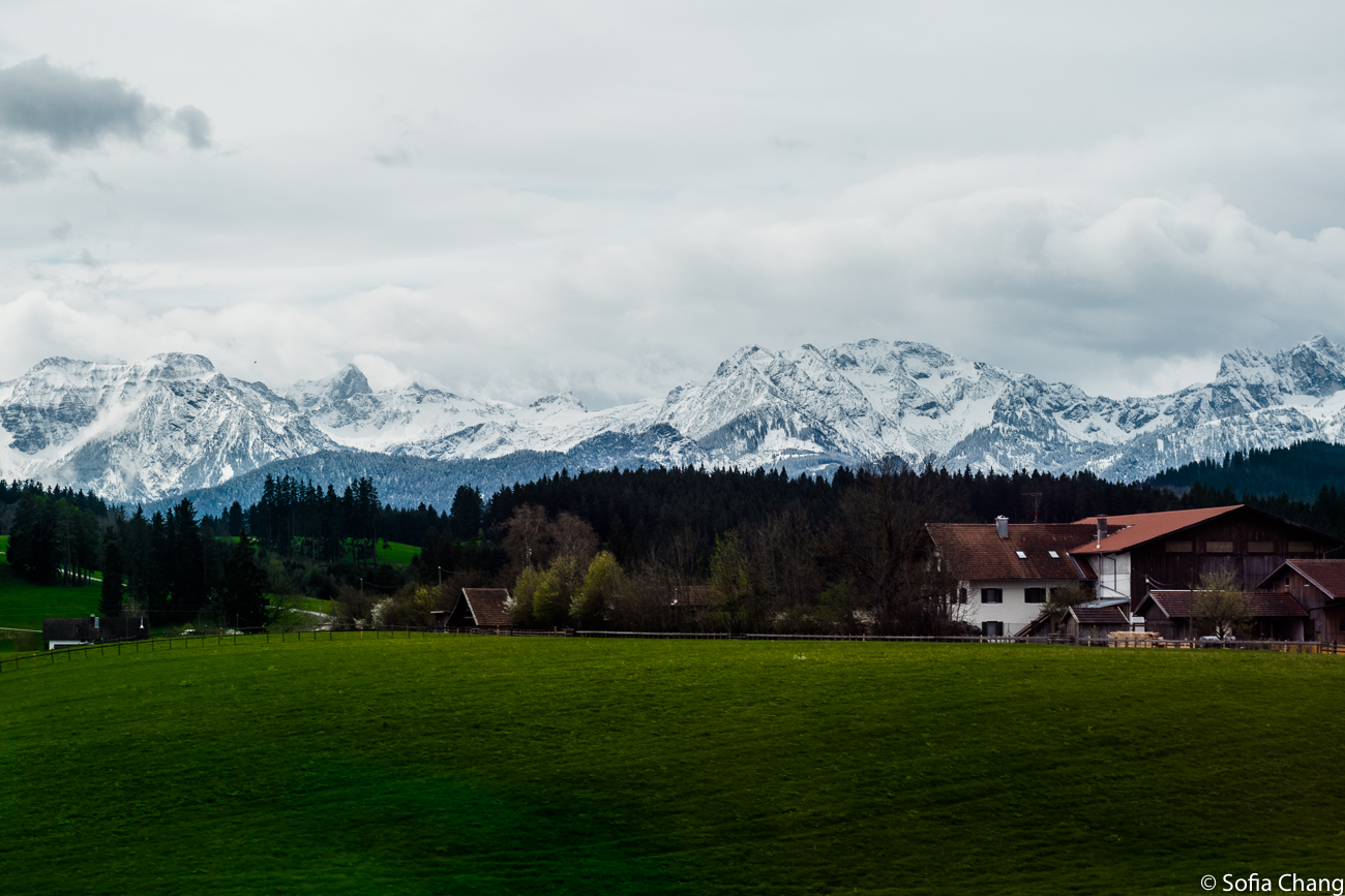 photo of a landscape with bavarian alps in the background